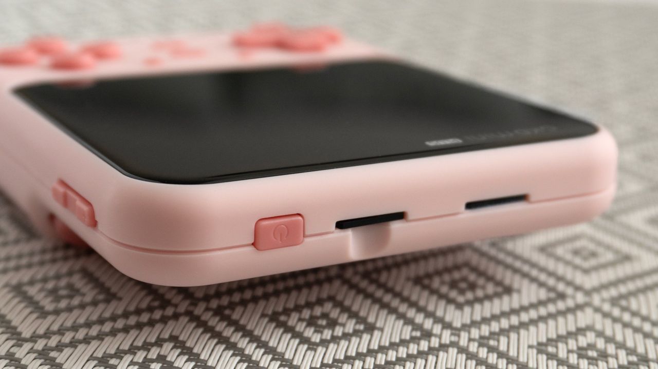 On the top of the GKD Mini Plus you'll find the power/sleep button and a pair of microSD card slots: one for games, and one for the device's software. (Photo: Andrew Liszewski | Gizmodo)